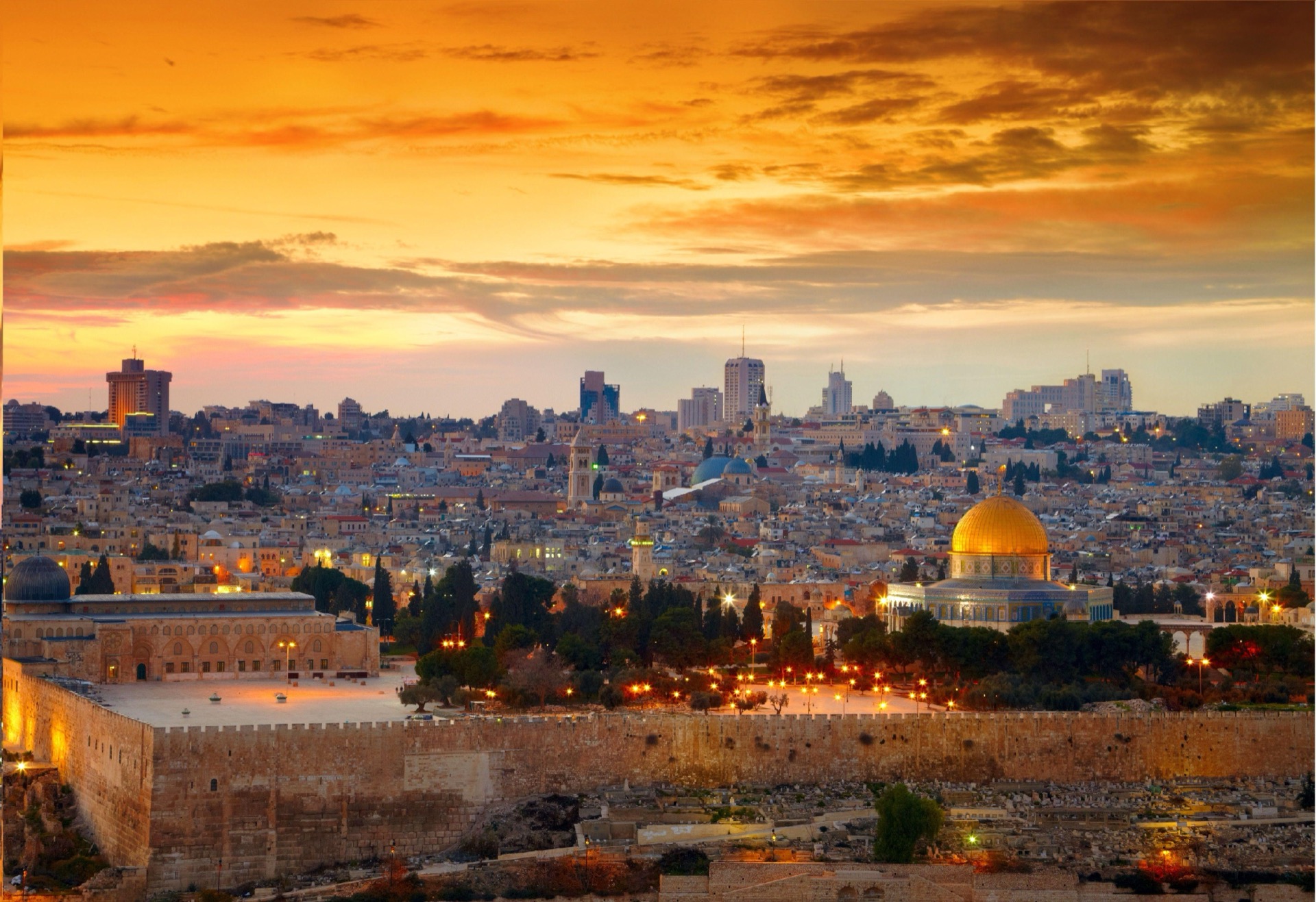 Jerusalem skyline at sunset — City Tower (Israel Prayer Tower) visible on the horizon